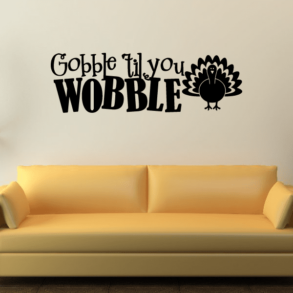 Vinyl wall decal with bold black 'Gobble Til you Wobble' text and turkey feather icon