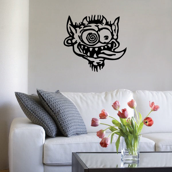 Wall sticker with a goblin's face in a cartoon style
