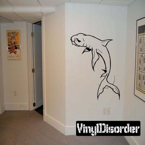 Shark decal with bold black outline of a swimming shark