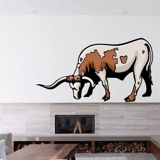 Grazing longhorn cow cattle sticker with brown and white body, horns, and tail.