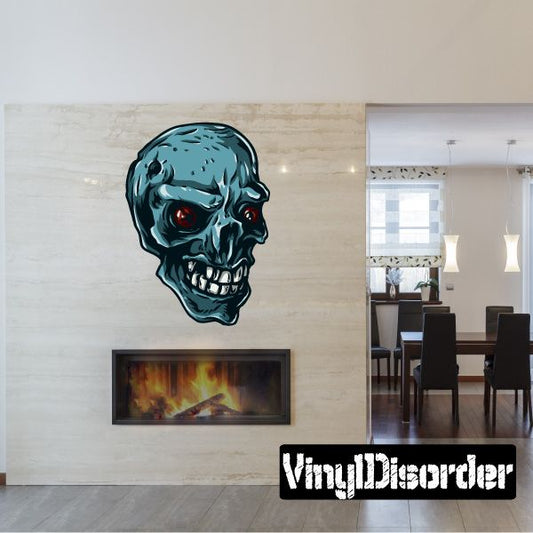 Teal grinning skull sticker with red eyes and white teeth