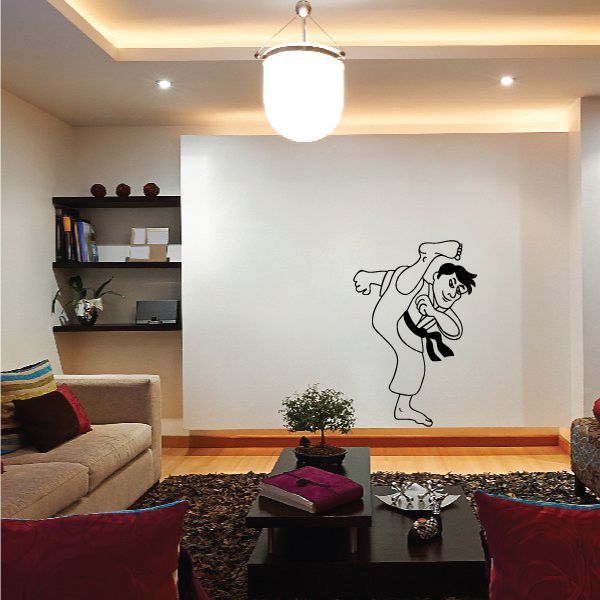 Karate wall decal of a man kicking with belt and open stance, black outline on light wall