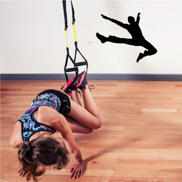 Gymnastics wall decal vinyl sticker: black gymnast silhouette midair with outstretched legs
