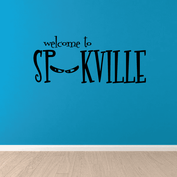 Halloween welcome decal reading 'Welcome to Spookville' with spooky eyes motif