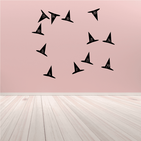 Set of black witch hat vinyl wall decals, scattered placement with pointed brims.