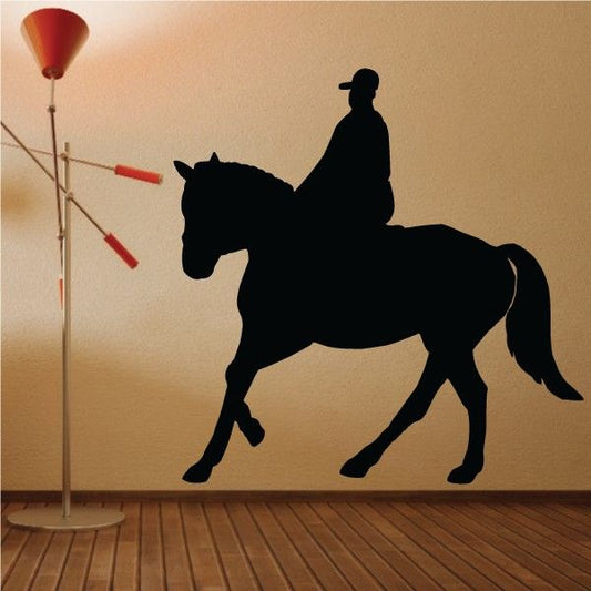 Horse and rider silhouette decal, black, on horse in side view