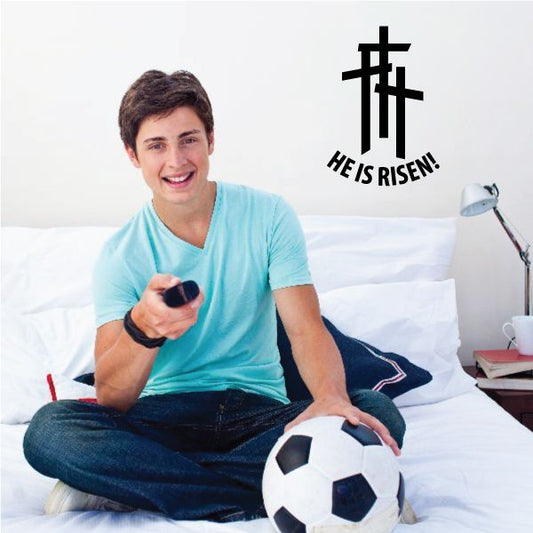 Religious decal of three crosses and He Is Risen text