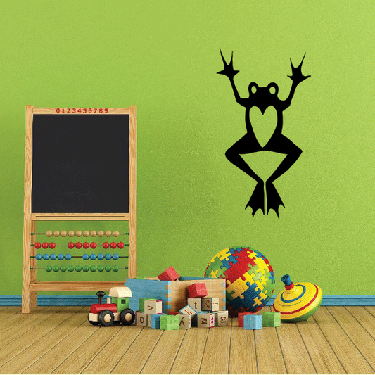 Heart frog wall decal: black frog holding green heart, arms raised.