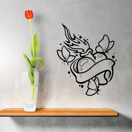 Angel wing heart vinyl wall decal with cross and spark accents, black outline