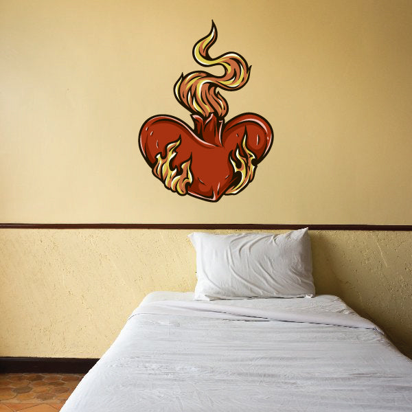 Bed with a red heart on flames sticker and additional wall decals