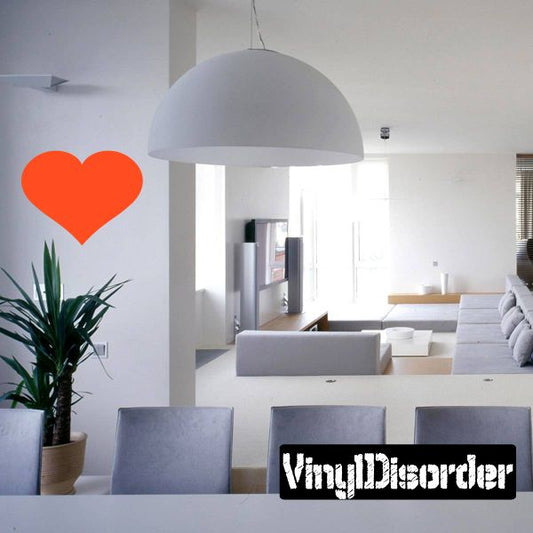 Orange full heart wall decal with solid color center and simple edges.