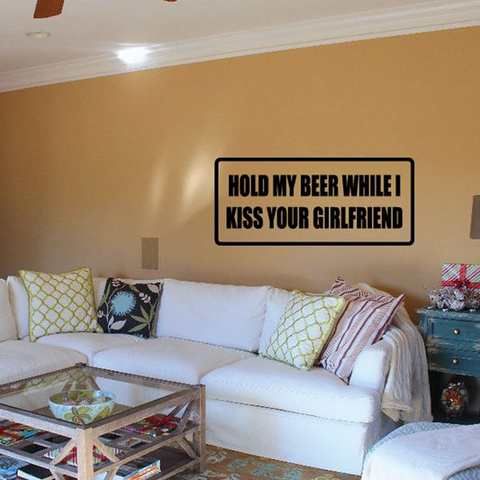 Black-bordered wall decal with text: HOLD MY BEER WHILE I KISS YOUR GIRLFRIEND