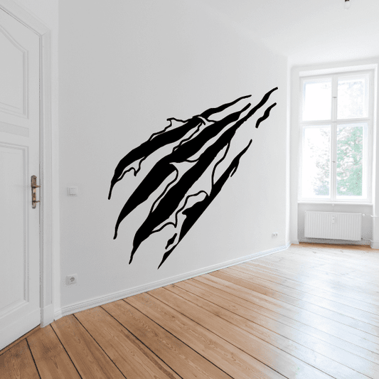 Black wall hole decal set with jagged claw-like shapes, multiple overlapping pieces.