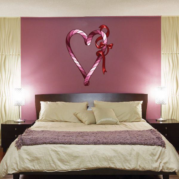 Heart loop sticker with pink-and-white striped candy cane style heart and red bow
