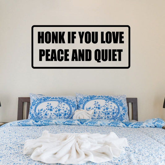 Wall decal with bold text: 'Honk if you love peace and quiet'.
