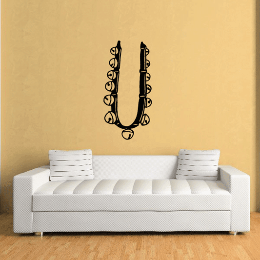 Black ornamental horseshoe bell decal with curled scrolls and bell accents