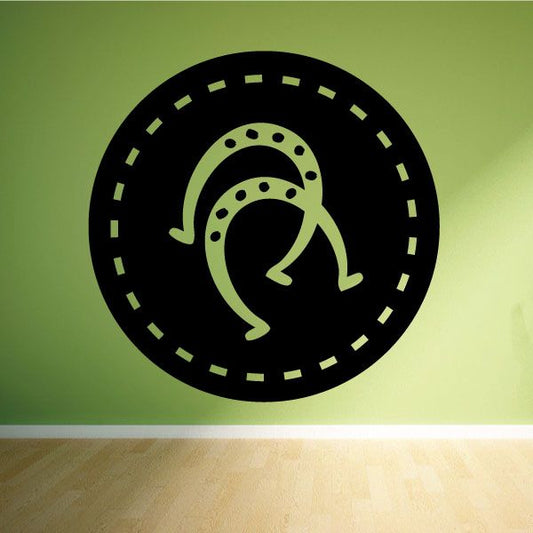 Circular horseshoe decal with black and green horseshoe emblem