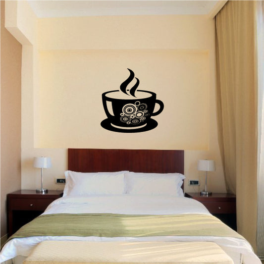 Cozy bedroom with a coffee cup wall sticker near the bed