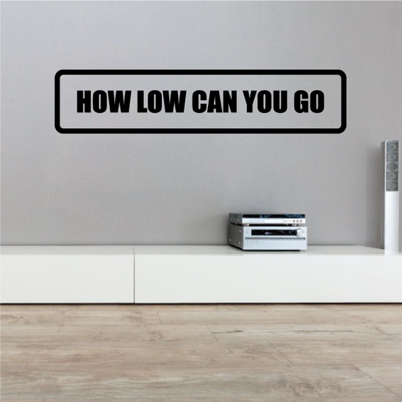Black-bordered white wall decal with bold 'HOW LOW CAN YOU GO' text