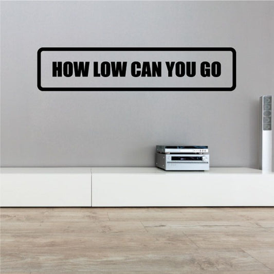 Black-bordered white wall decal with bold 'HOW LOW CAN YOU GO' text