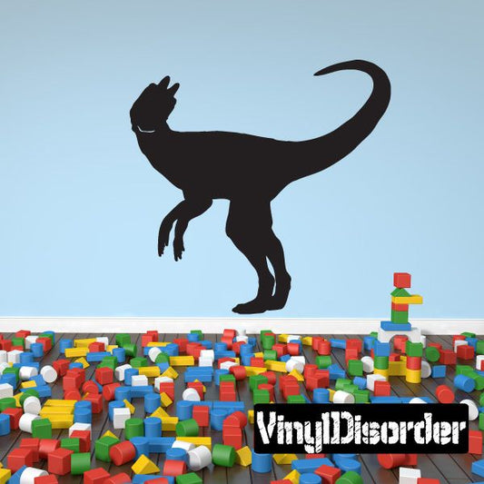 Black hungry Dilophosaurus dinosaur wall decal with open mouth and raised frill