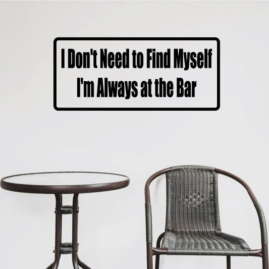 Bar wall decal with bold lettering: 'I Don't Need to Find Myself'