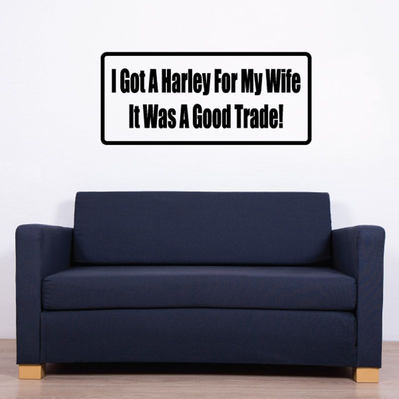 Rectangular wall decal with black border and bold white quote text: "Good Trade!"