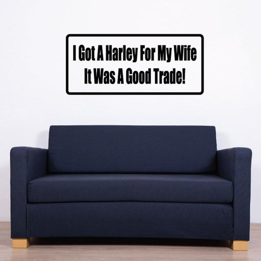 Rectangular wall decal with black border and bold white quote text: "Good Trade!"
