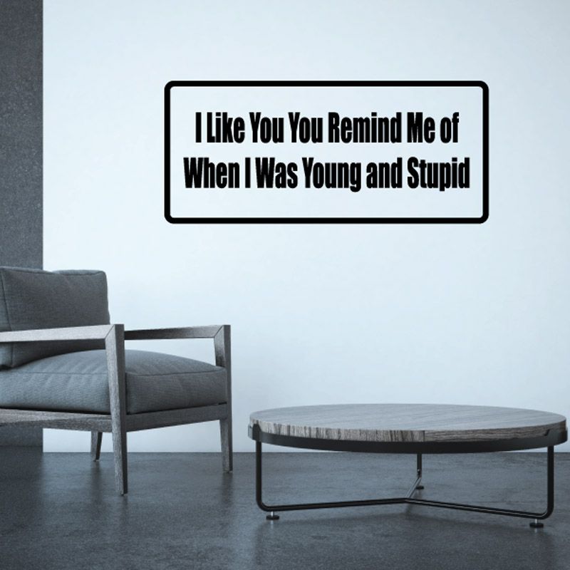 Rectangular wall decal with black outline and bold message text on light background