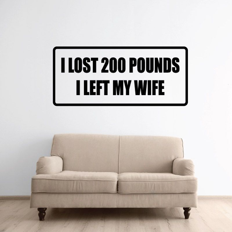 Rectangular wall decal with bold black text: I LOST 200 POUNDS I LEFT MY WIFE