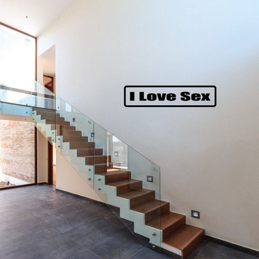 Wall decal with bold black text "I Love Sex" in rounded rectangle