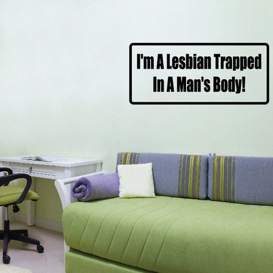Rectangular wall decal with bold black slogan: lesbian trapped in man's body