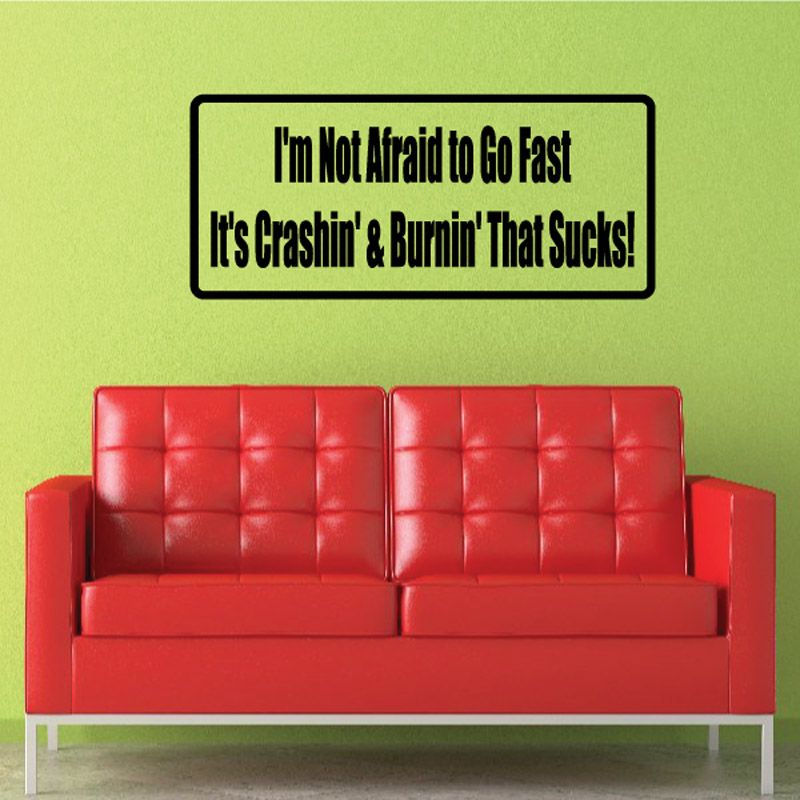 Rectangular wall decal with quote: I'm Not Afraid to Go Fast, black text on white border.