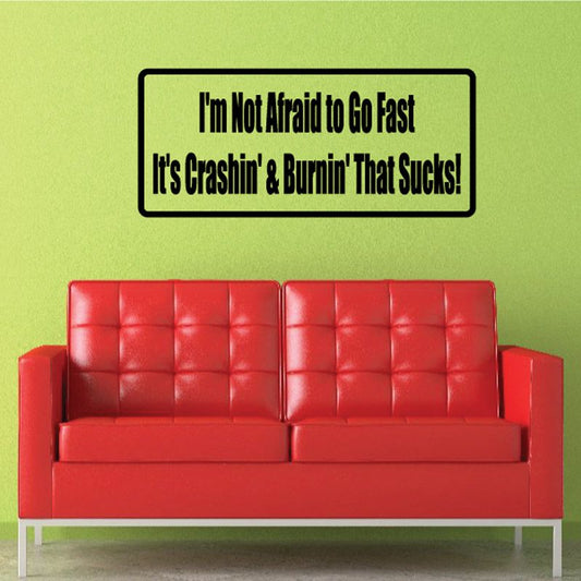 Rectangular wall decal with quote: I'm Not Afraid to Go Fast, black text on white border.