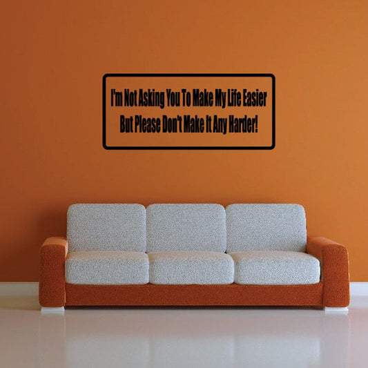 Rectangular wall decal with black border and motivational quote text on orange background