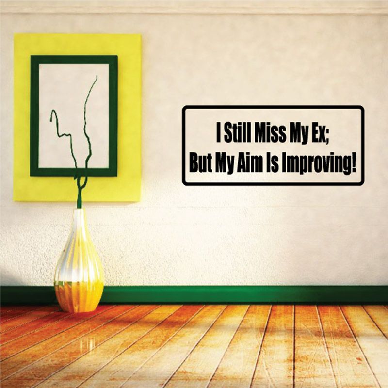 Wall decal with black rounded rectangle and white text: I Still Miss My Ex; Aim improving.