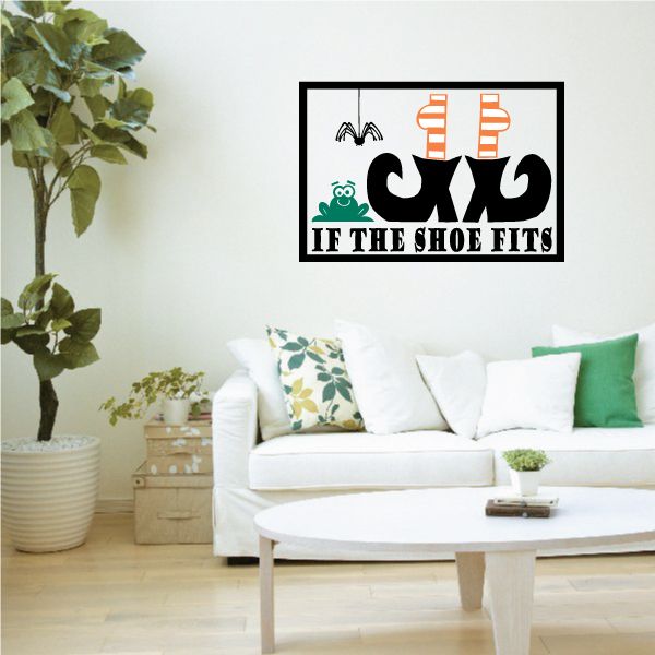 Halloween decal with black shoes, orange striped bottles, and green text
