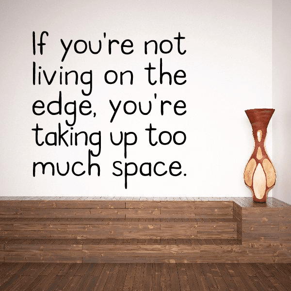 Wall quote decal with 'living on the edge' message and hourglass graphic