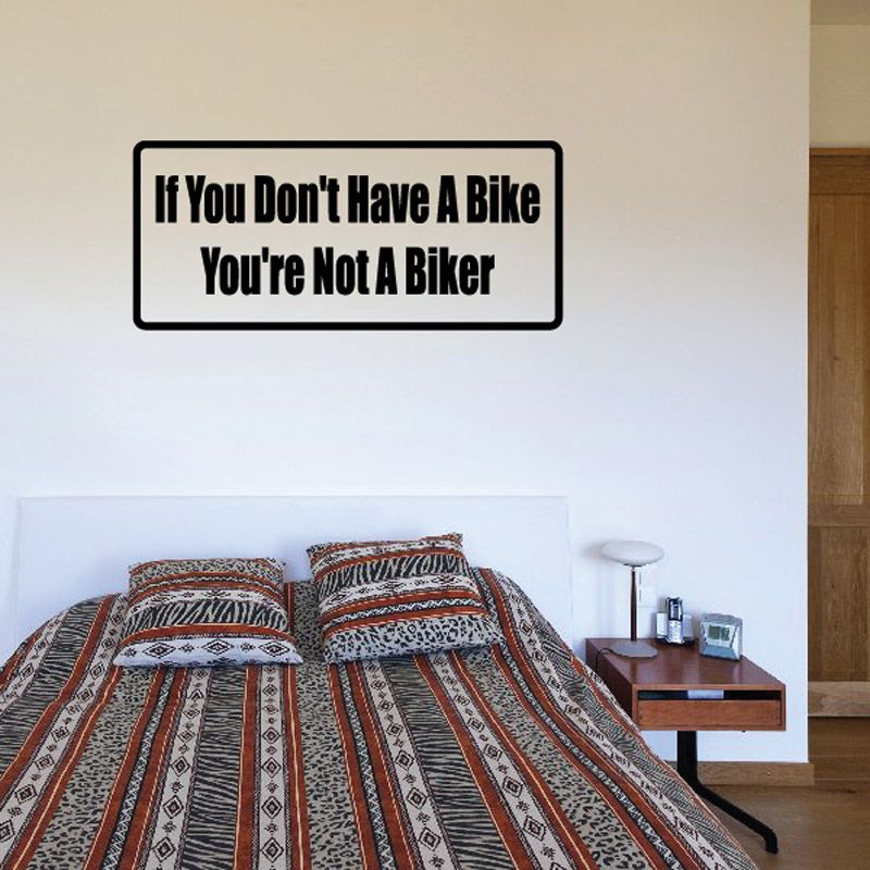 Bike you're not a biker quote decal, bold black text on white rectangle