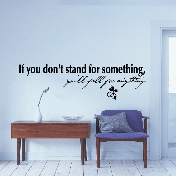 Inspirational wall decal with black quote text and small floral icon