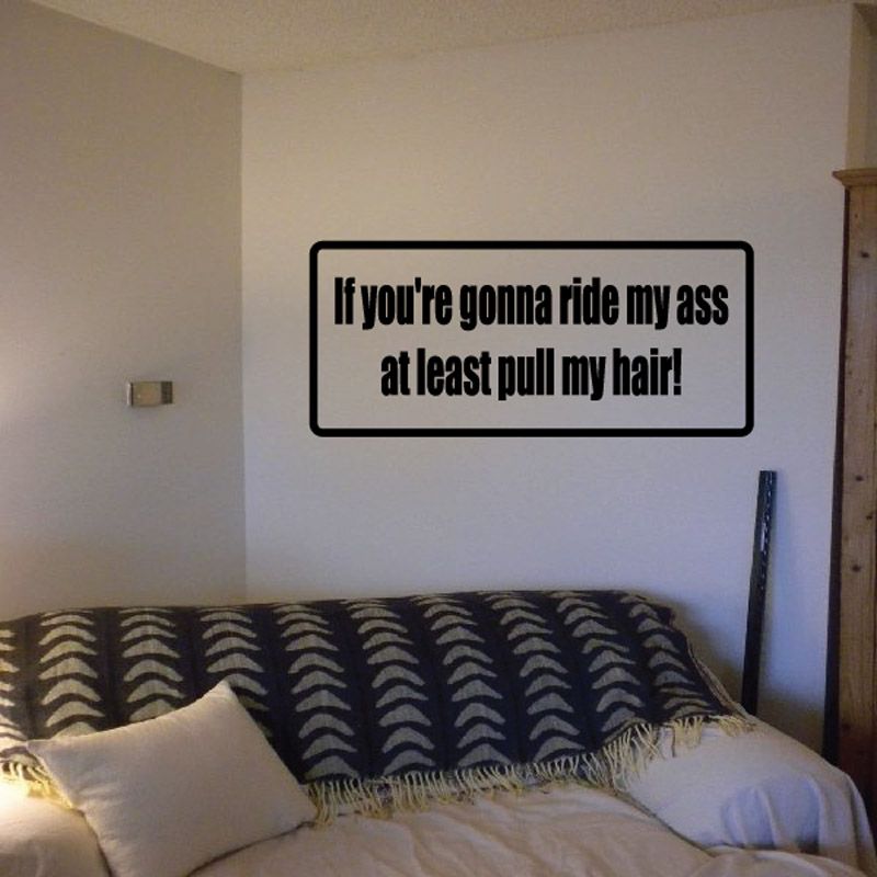 Rectangular wall decal with black quote text and thick border: “If you’re gonna ride my ass…”
