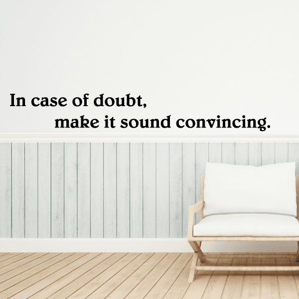 Wall quote mural decal with black text: “In case of doubt, make it sound convincing.”