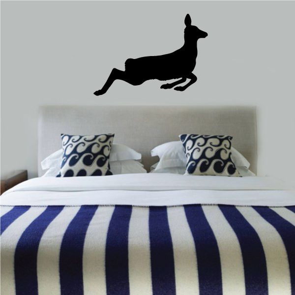 Deer silhouette wall decal in flight, black