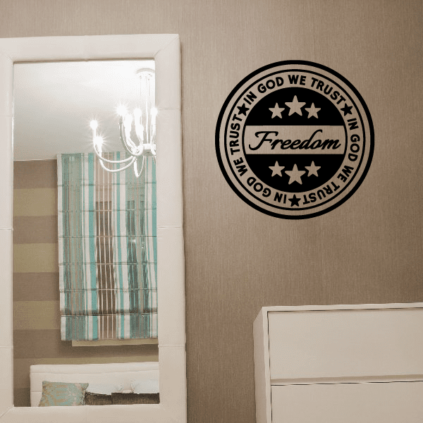 Circular wall decal with "IN GOD WE TRUST" and "Freedom" script inside a black border