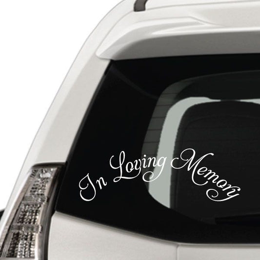 In loving memory vinyl decal with white cursive text on dark car window