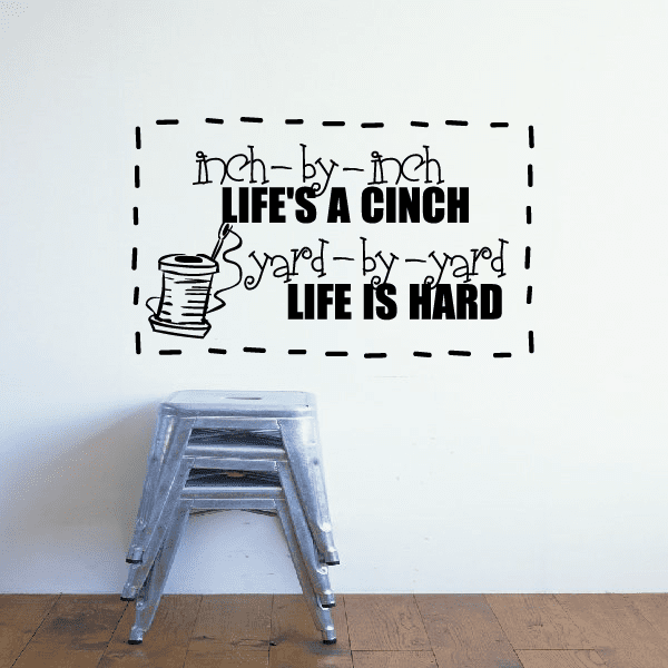 Sewing decal with black sewing-themed quote and spool icon, dashed border design