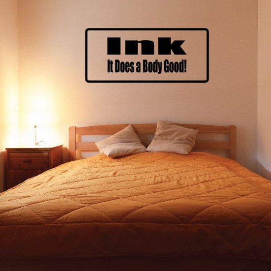 Black wall decal reading “Ink It Does a Body Good!”