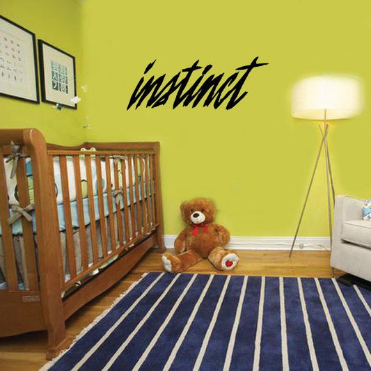 Black cursive wall decal reading instinct