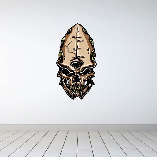 Alien skull sticker with tan, dark and green accents, detailed cartoon face