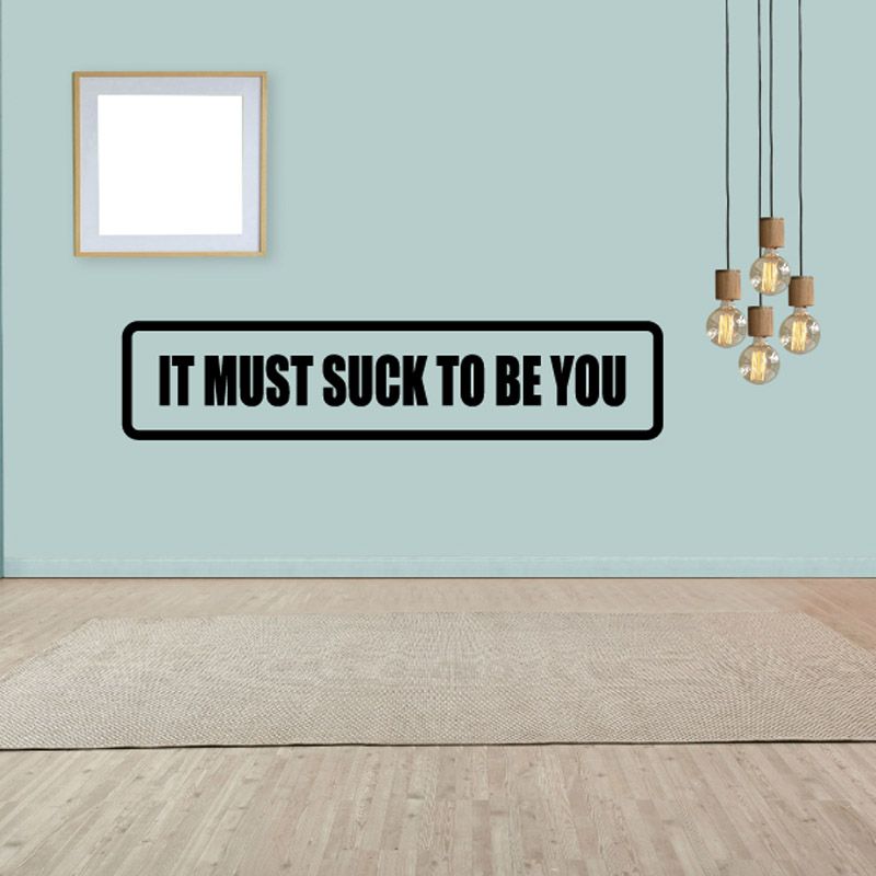 Wall decal with bold black border and white text: 'It must suck to be you'.